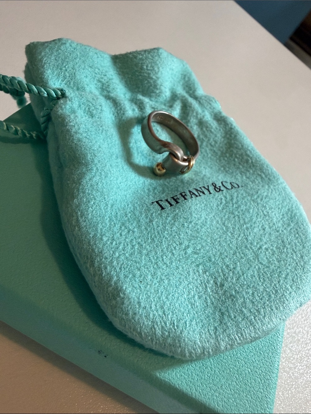 Tiffany & Co. Silver Knot Ring‎ with Gold Accent on Blue Pouch and Box